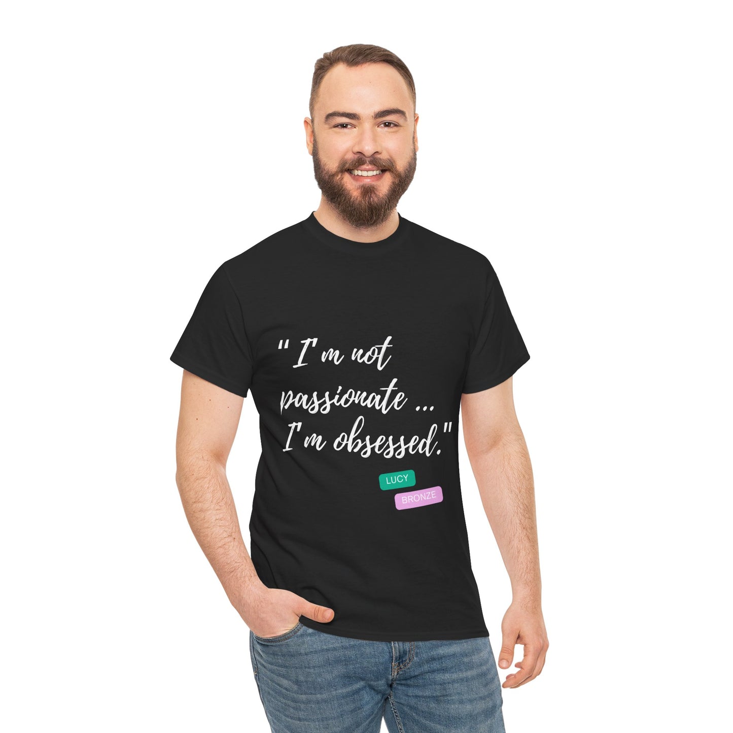 Unisex heavy cotton T-shirt with bold “Not Passion. Obsession.” text design, inspired by the ethos of being Unapologetically Obsessed. Available in charcoal, black, light pink, navy, and sport grey. Emphasizes quality, comfort, and the story of autism and ADHD empowerment tied to the Lioness icon.