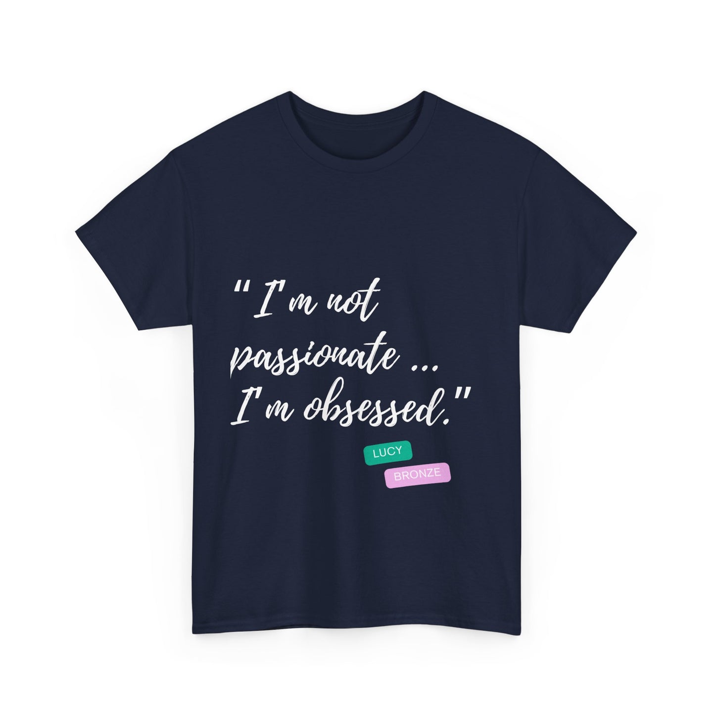 Unisex heavy cotton T-shirt with bold “Not Passion. Obsession.” text design, inspired by the ethos of being Unapologetically Obsessed. Available in charcoal, black, light pink, navy, and sport grey. Emphasizes quality, comfort, and the story of autism and ADHD empowerment tied to the Lioness icon.